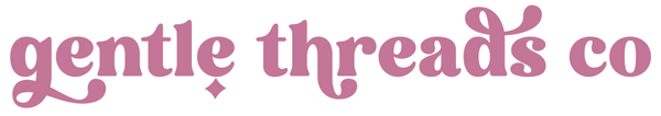 Pink 'gentle threads co' text on a white background.